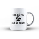 Porslinsmugg med texten "Lita på mig jag är bonde"