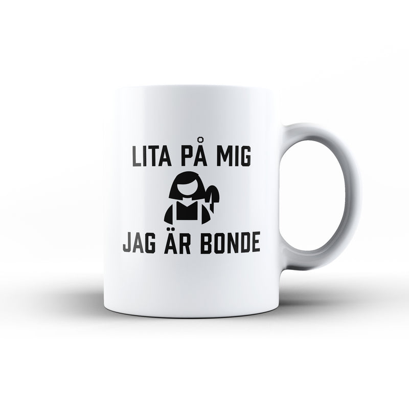 Porslinsmugg med texten "Lita på mig jag är bonde"