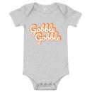 Babybody med texten "Gobble gobble"