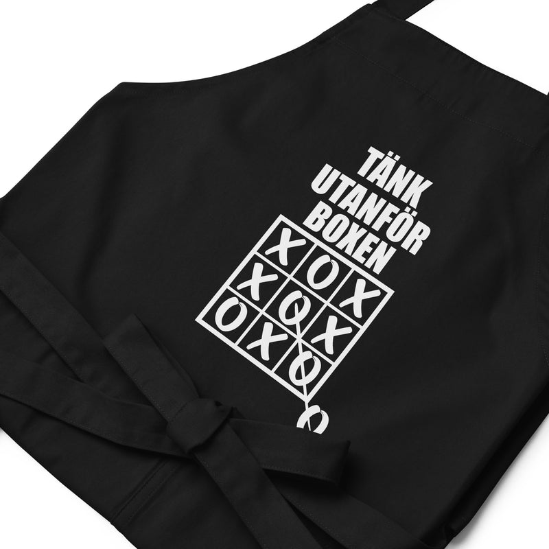 Förkläde med texten "Tänk utanför boxen"