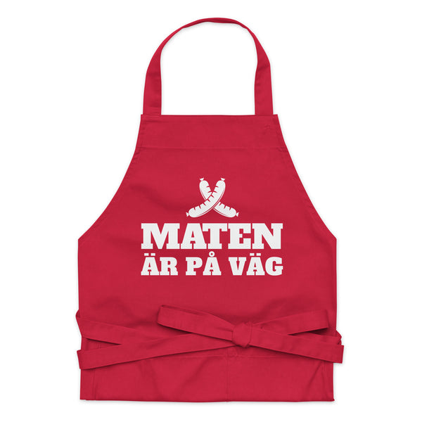 Förkläde med texten "Maten är på väg"