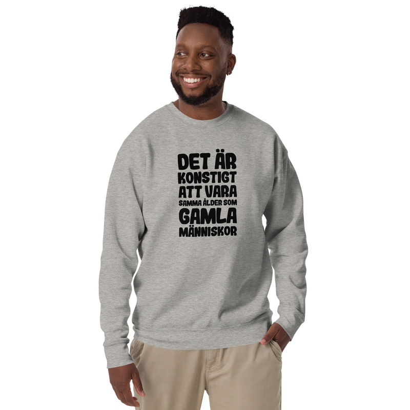 Sweatshirt med texten "Det är konstigt"