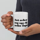 Porslinsmugg med texten "Det ordnar nog upp sig under dagen"